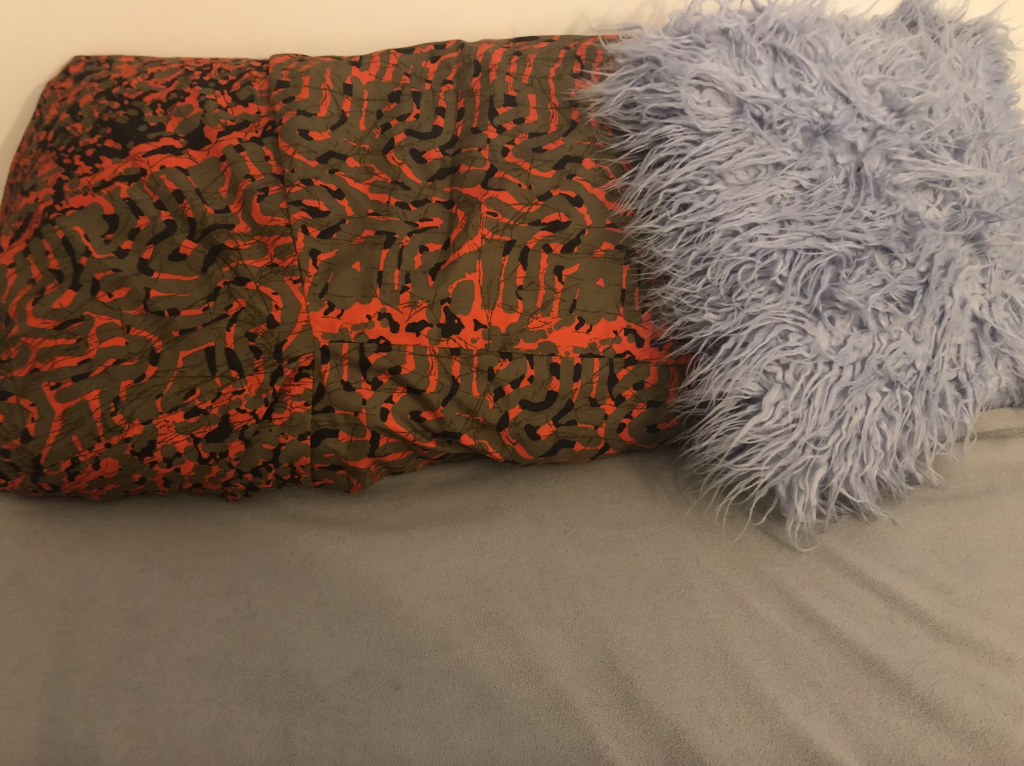 My African print pillow next to my faux fur pillow