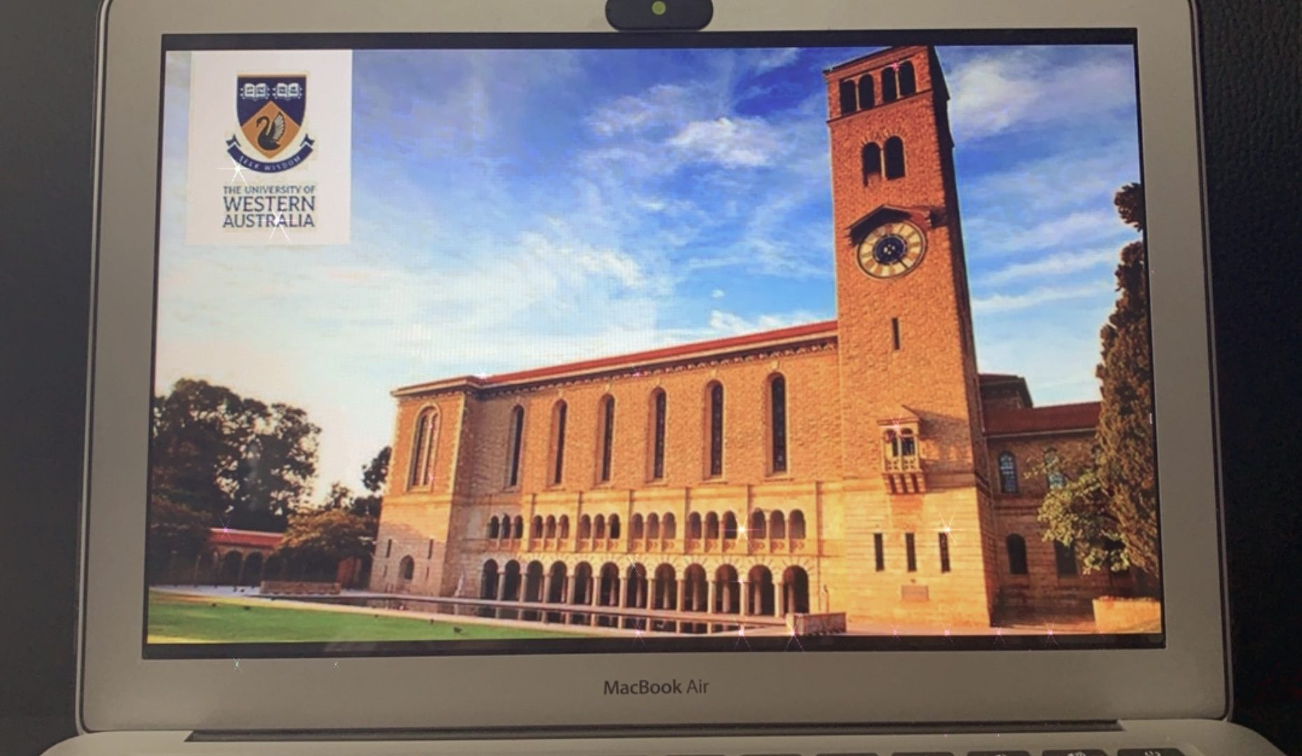 MacBook Air with a picture of the UWA building on the screen