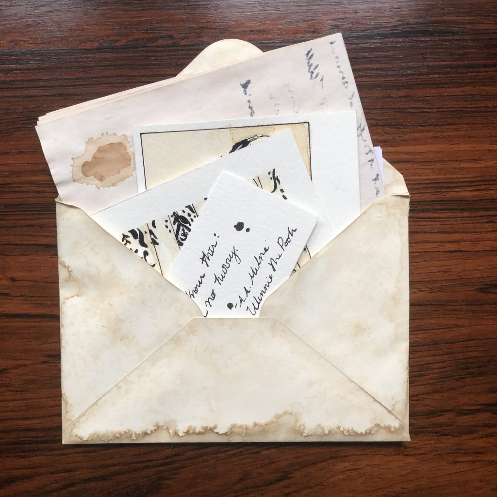 Open envelope with a letter and some drawings inside.