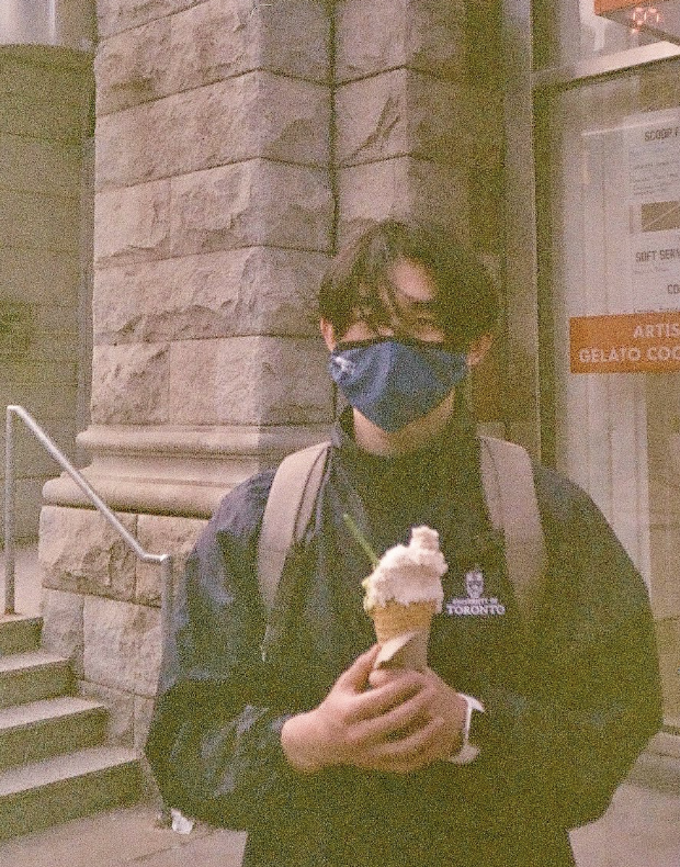 a student holding an ice cream cone