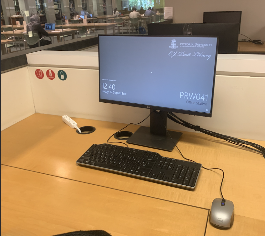 A Library desktop on a desk, at a computer station in E.J. Pratt Library