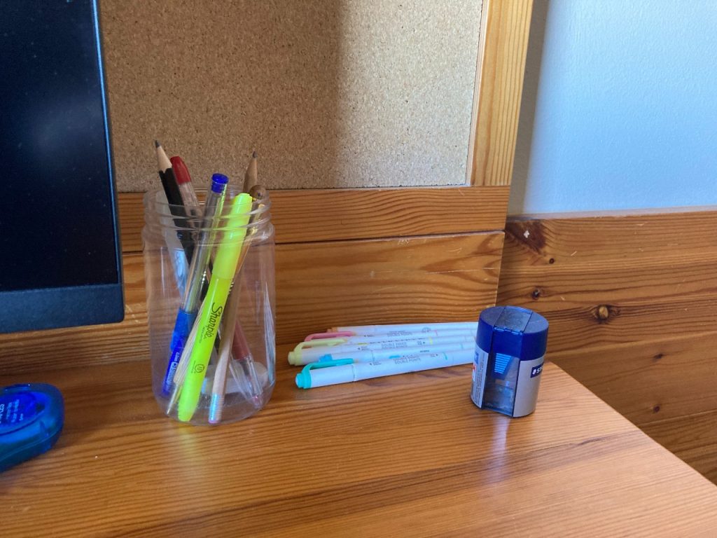 stationary (pens, pencils, highlighters) on desk