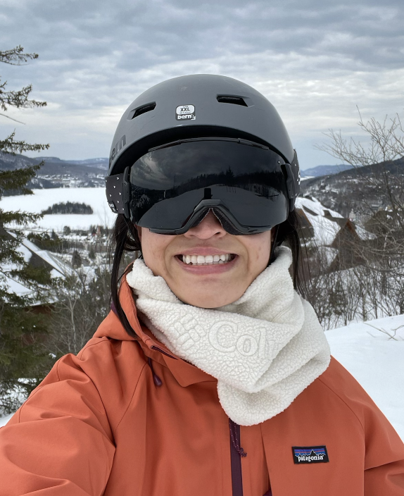 cheryl smiling under a ski helmet, goggles, with a gaiter