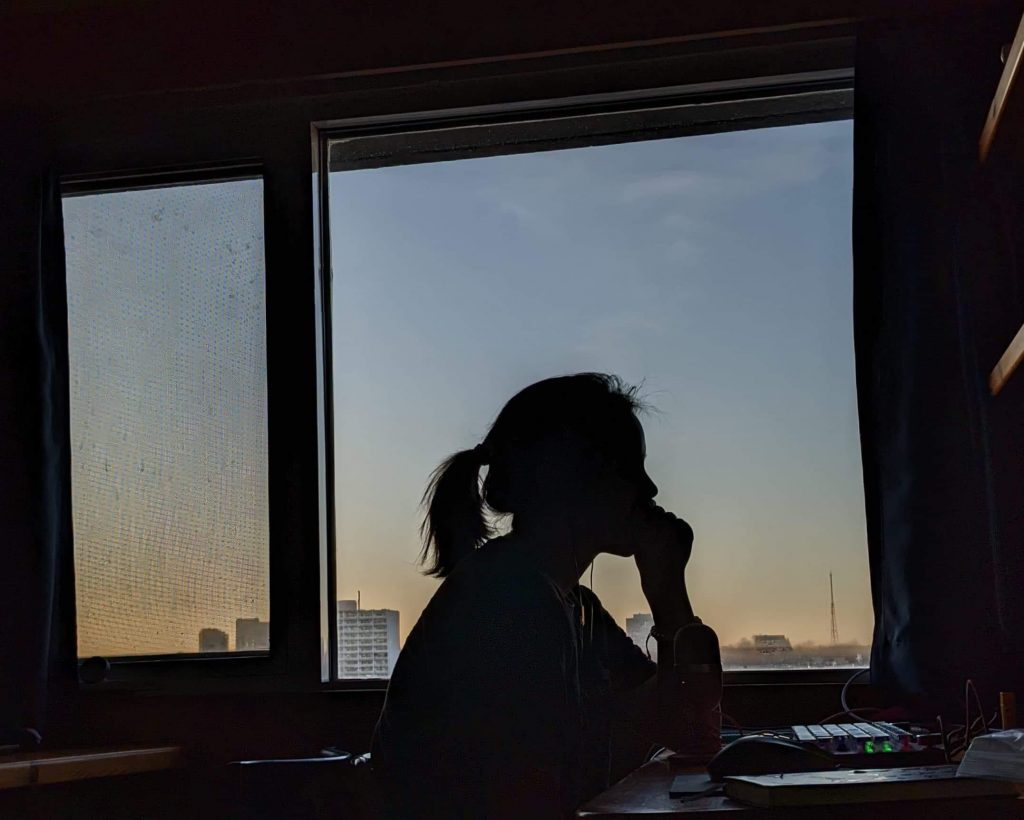 silhouette of girl studying at desk
