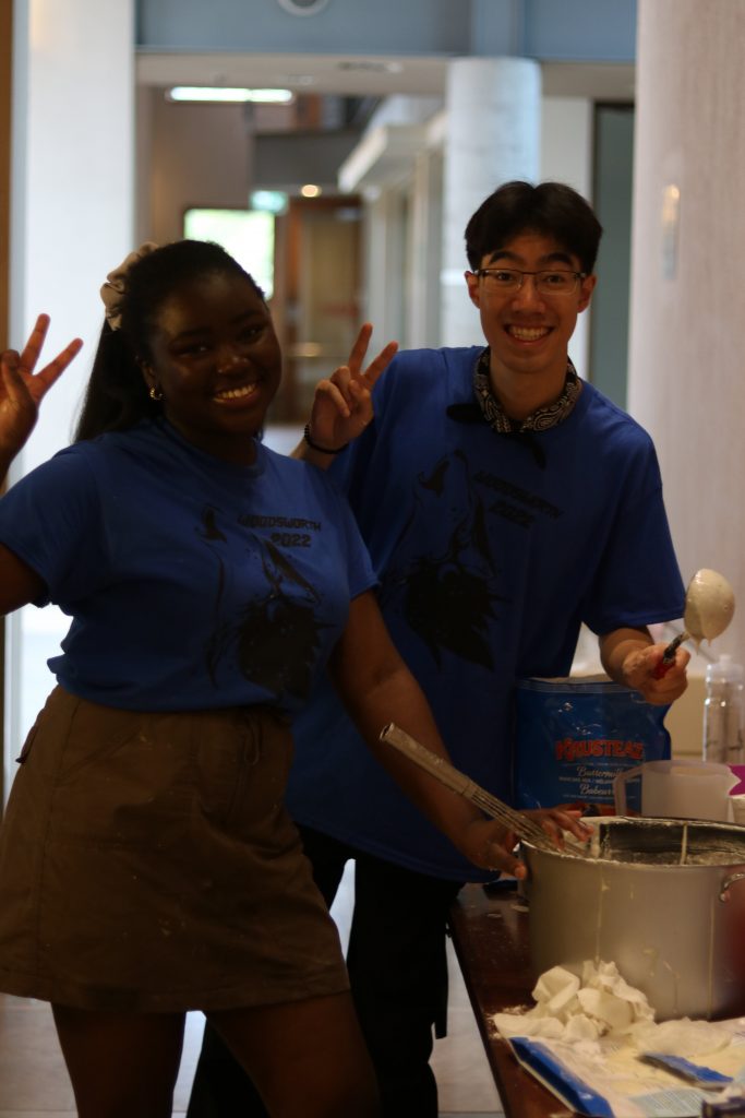 Here's a photo of Bolu and Ben making pancakes at Woodsworth Orientation.