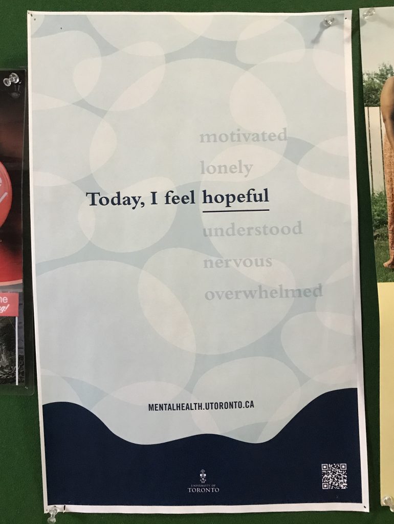 A paper poster that says "today, I feel hopeful"