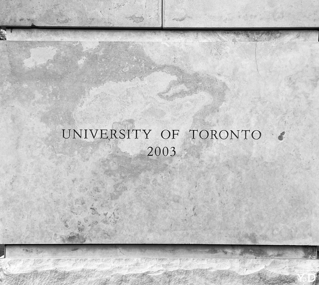 Photo of a stone pillar with text: "University of Toronto 2003"