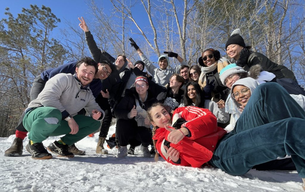 Photo of a group of 15 students outside in the snow.