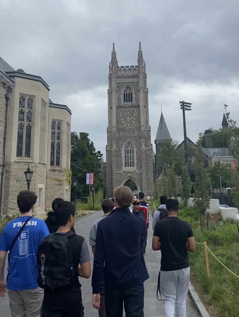 Students walking on the University of Toronto campus as part of a tour