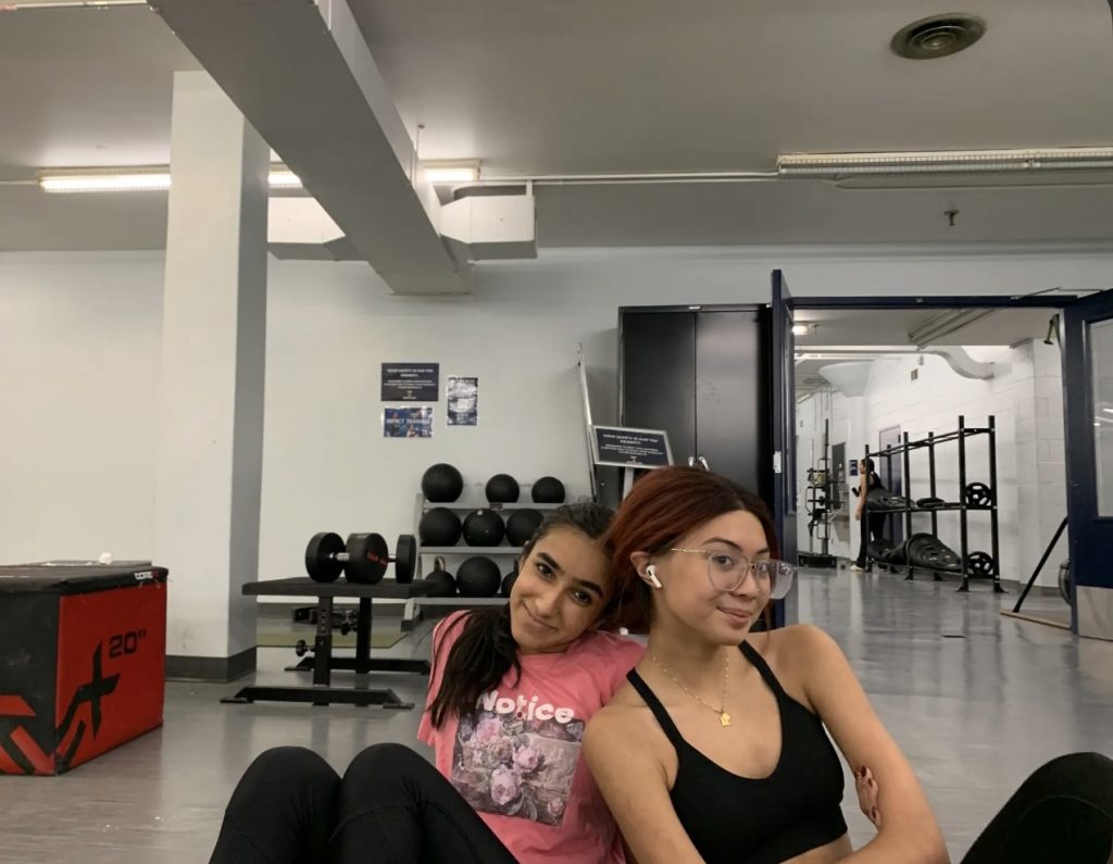 Photo of Selina and her friend Zainab at the gym, smiling