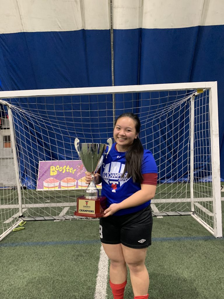 Jessica holding a Intramural Champions Cups