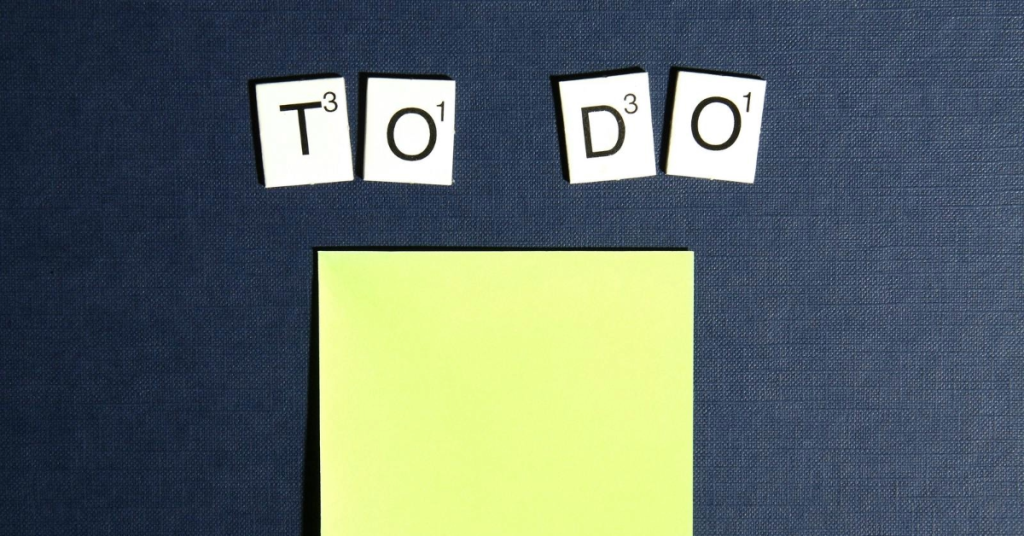 Scrabble tiles that spell out "To Do" with a sticky note