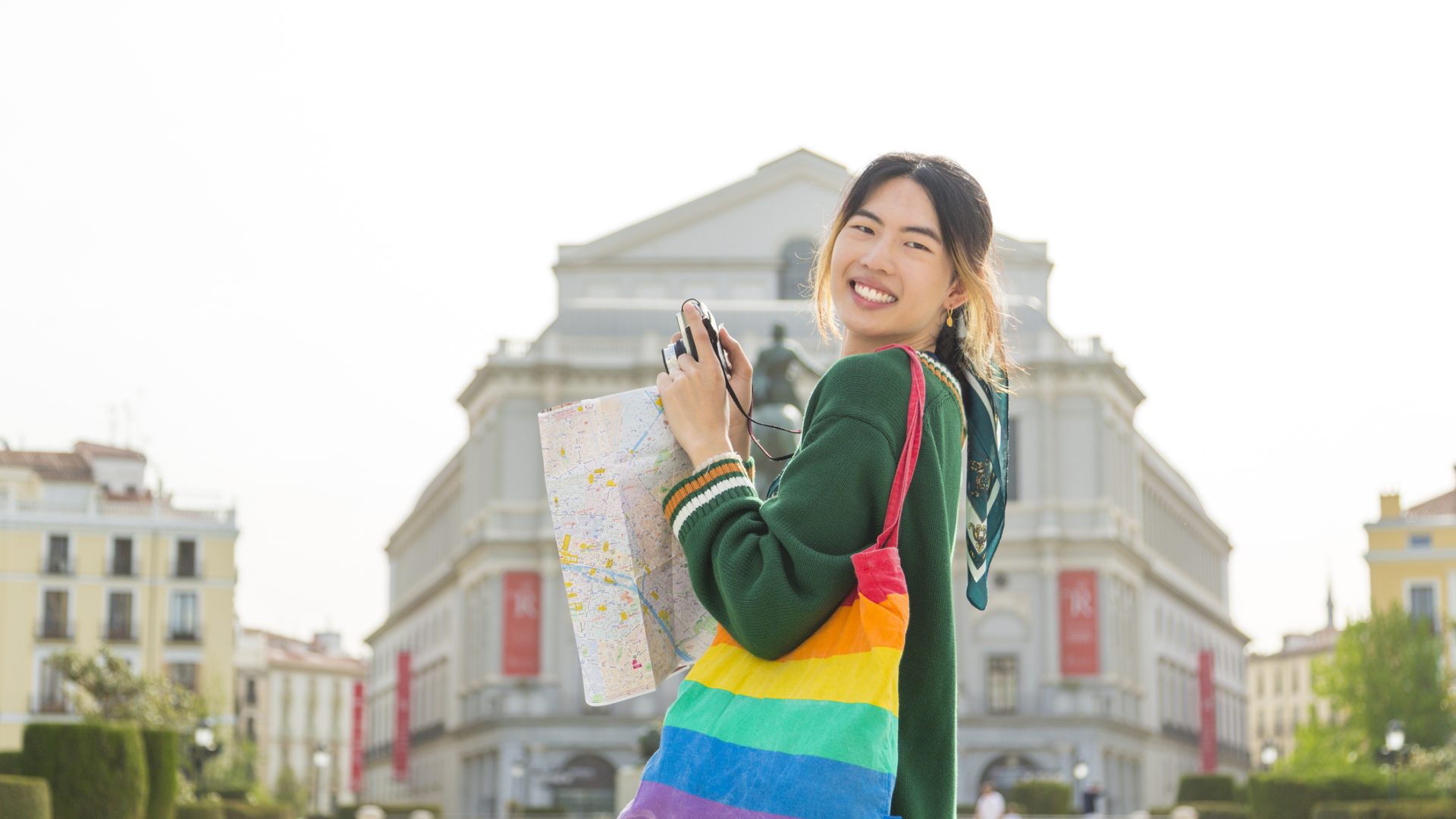 Non-binary student in a foreign city