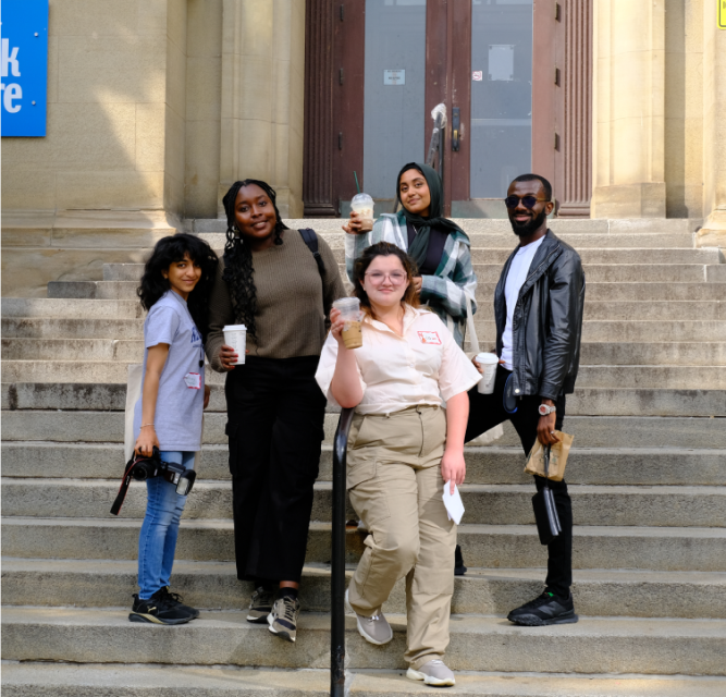 Five international students in front of the University of Toronto Book Store