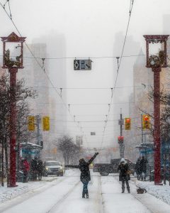 Person dancing in snowy streets of Toronto