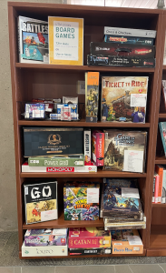A shelf containing board games.