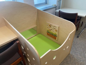 A baby infant seating area or playpen.