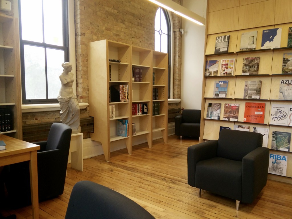 a warm toned library with sofas at Daniels