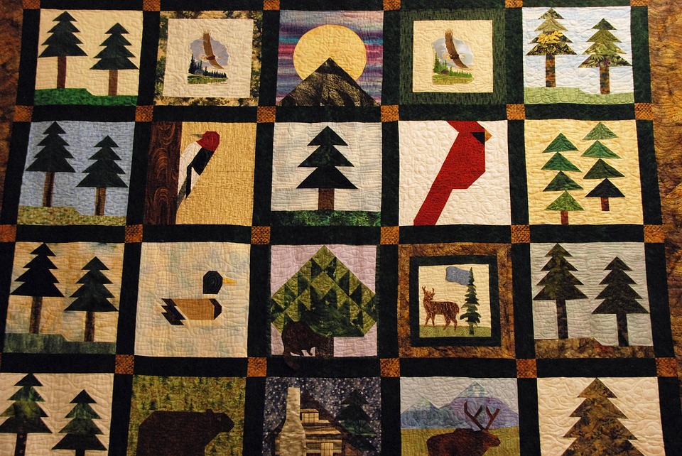 A quilt with various nature patterns