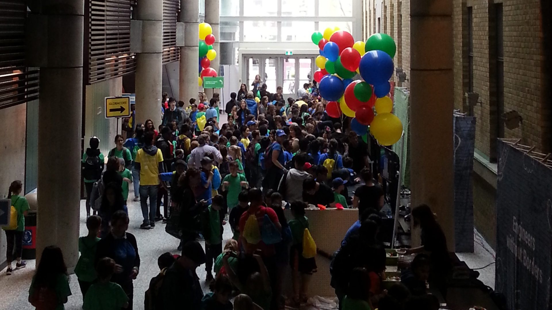 Bahen Centre main hallway decked in balloons and filled with students