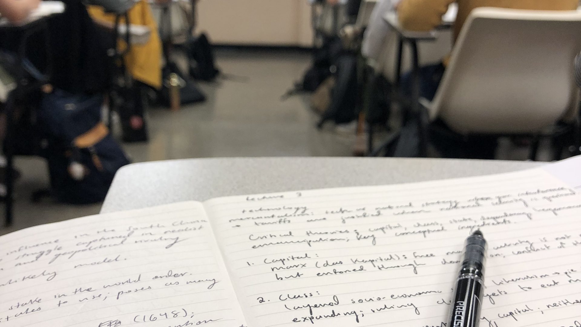 image of notes on a desk in class