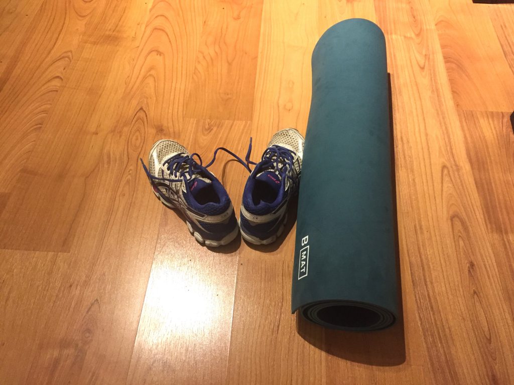 Image of running shoes and yoga mat