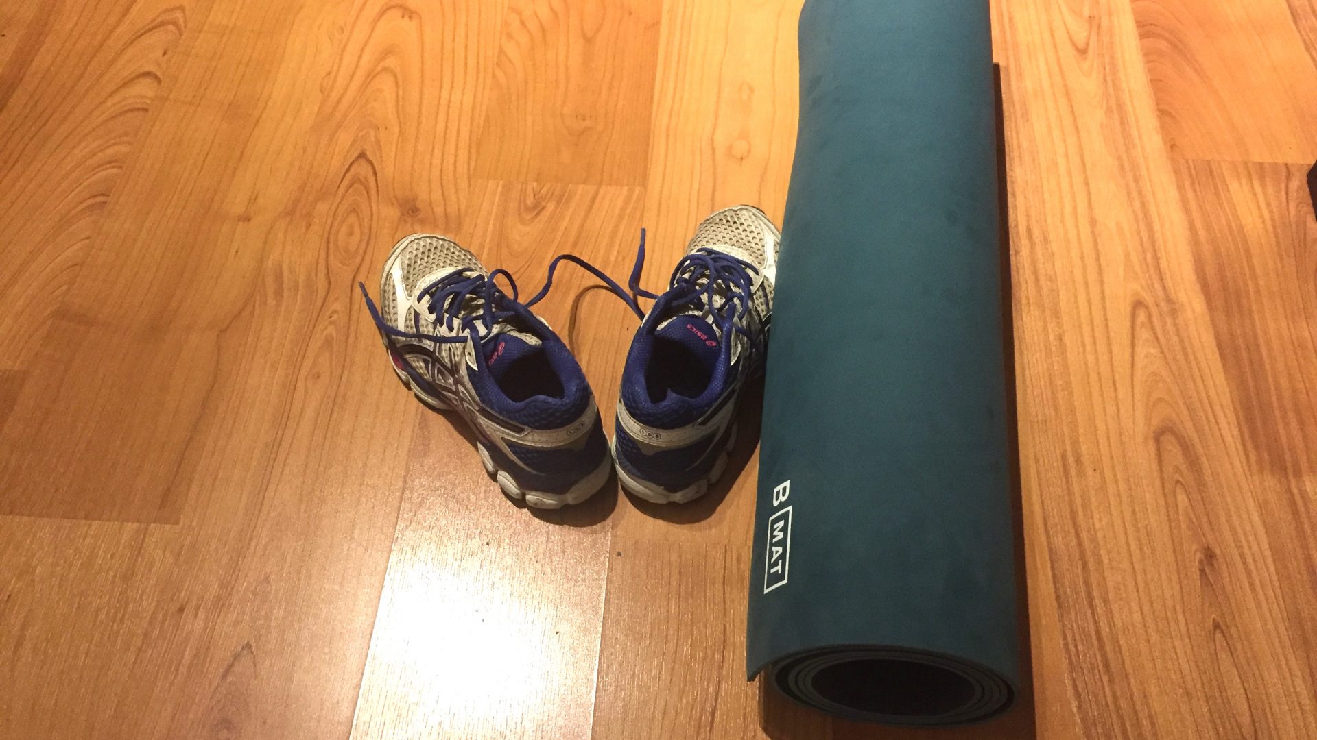 Image of running shoes and yoga mat