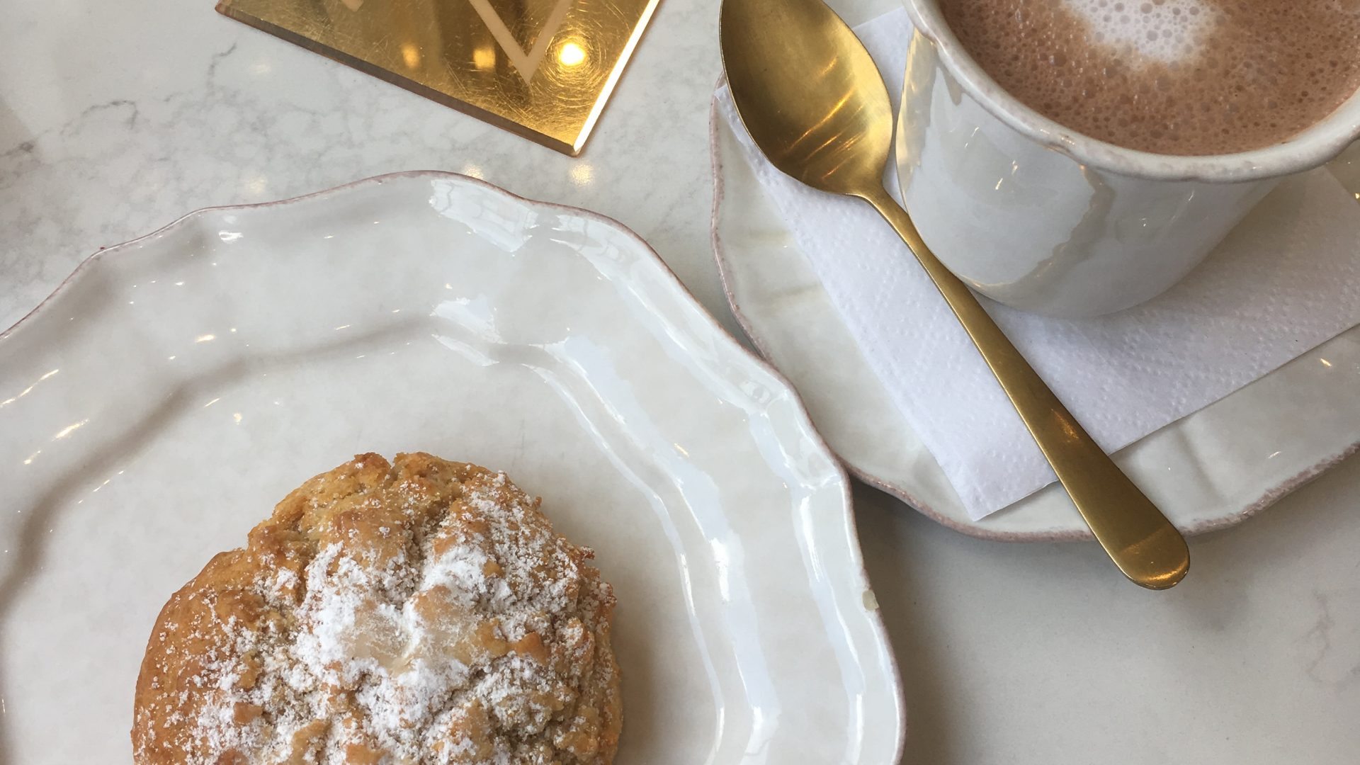 A scone and a hot chocolate from Sorelle and Co.