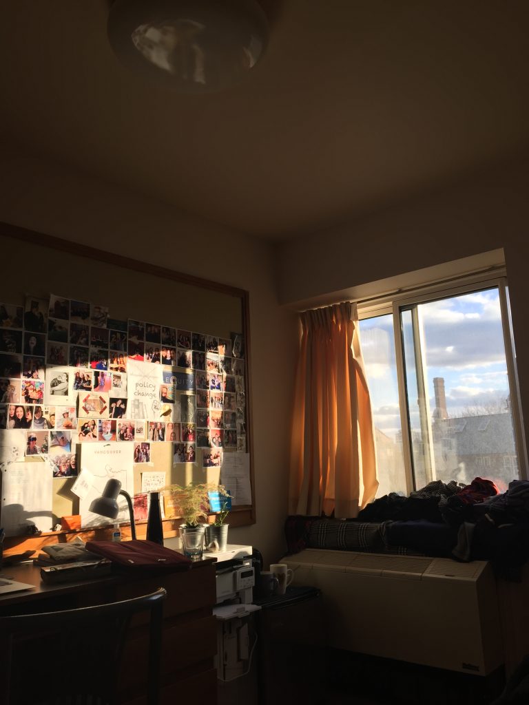A view of a bedroom window and desk.