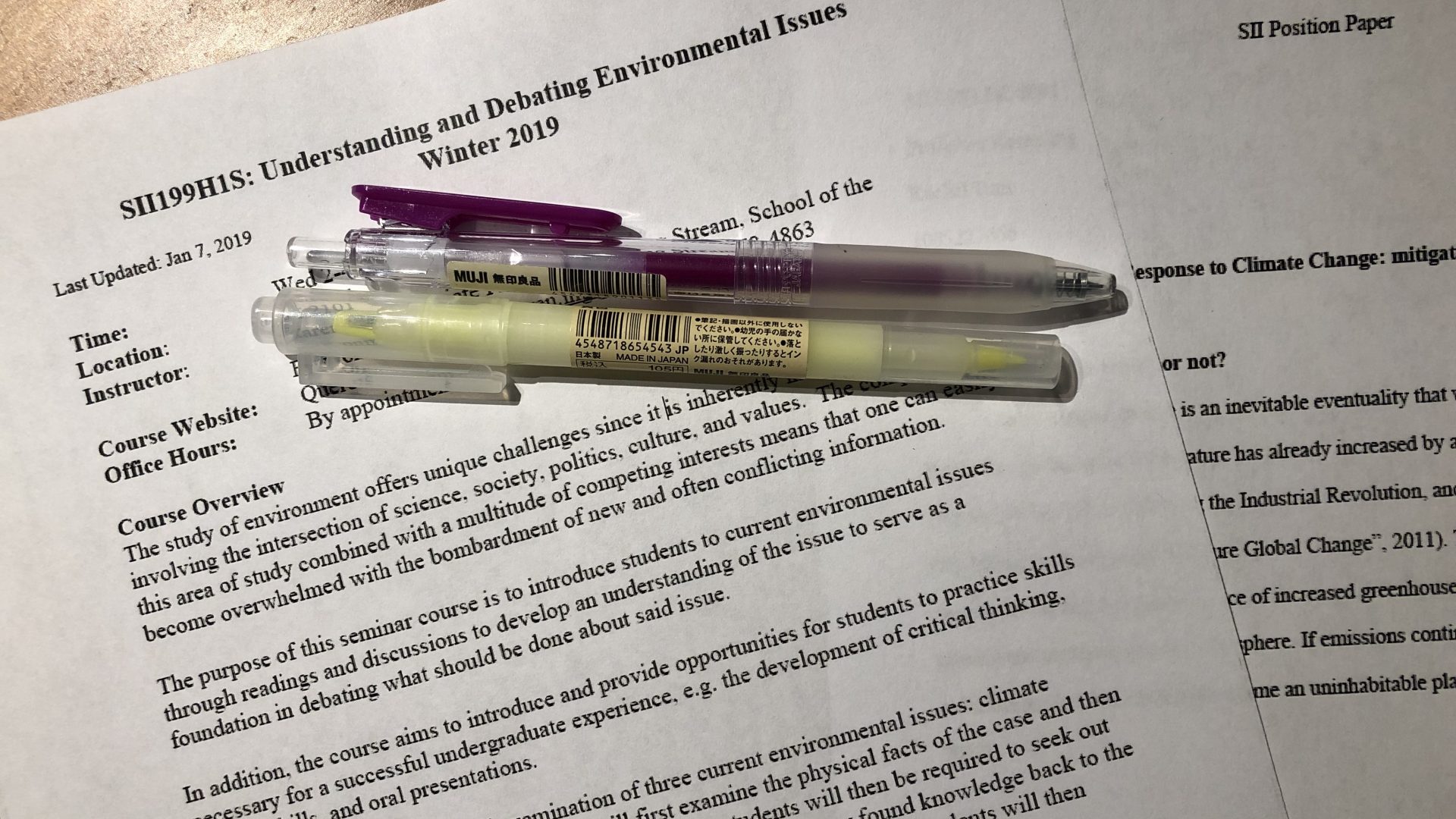 Picture of pens, SII 199 syllabus, and SII debate paper
