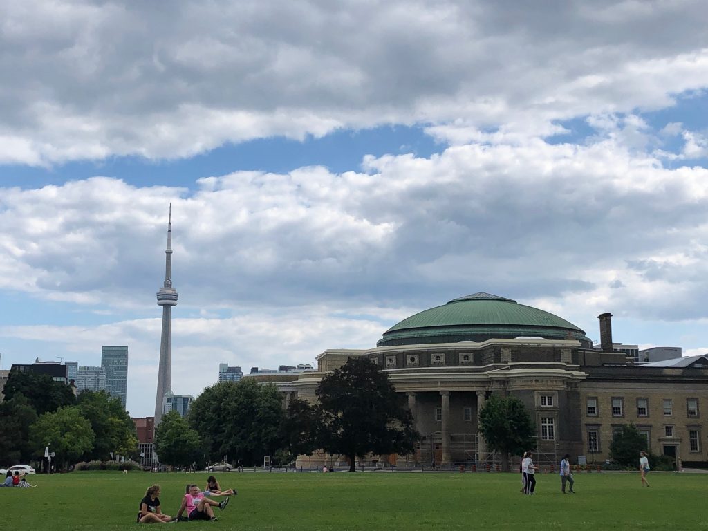 Picture of the convocation hall and the CN tower at the U of T St.George campus