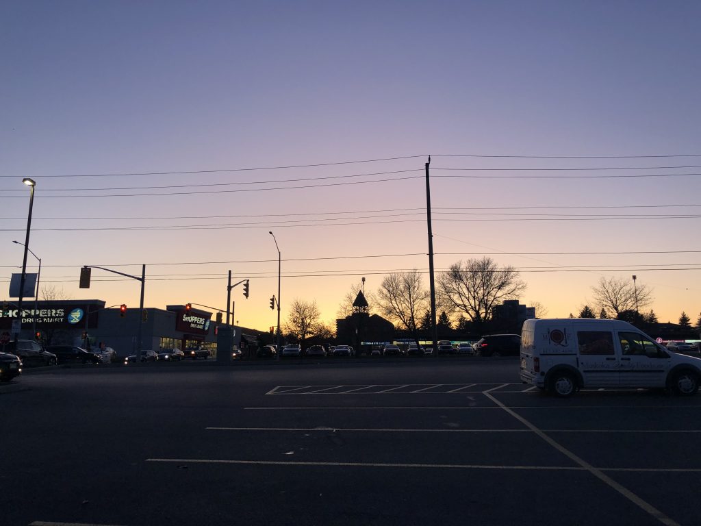 Sunset in parking lot.