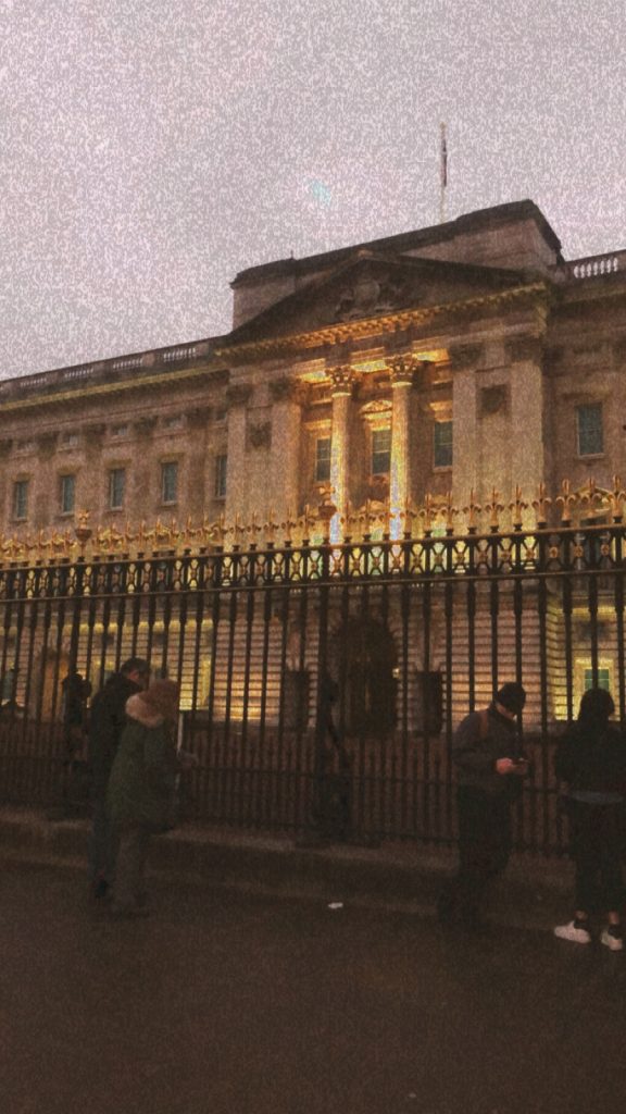 The front view of Buckingham Palace. The picture is edited to make the image look grainy