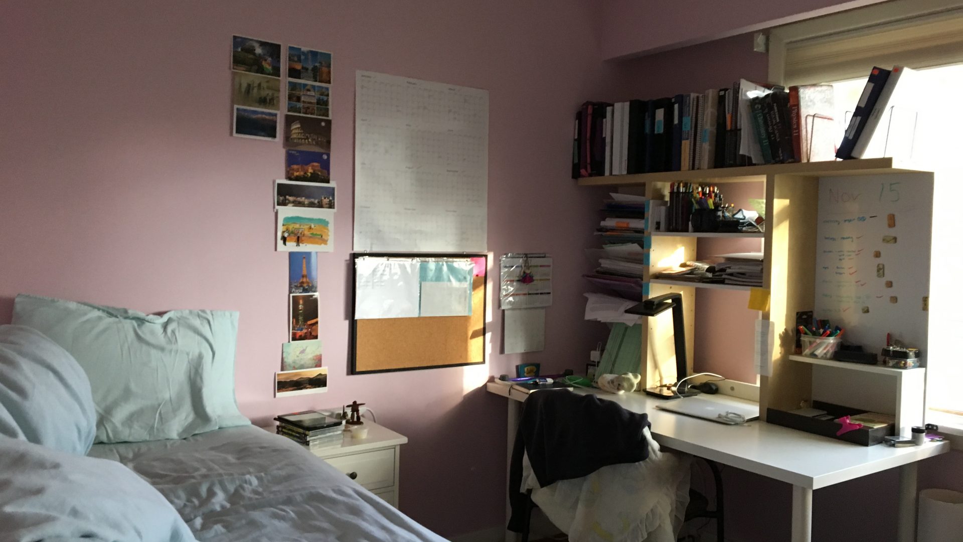 Photo of bedroom with desk filled with homework