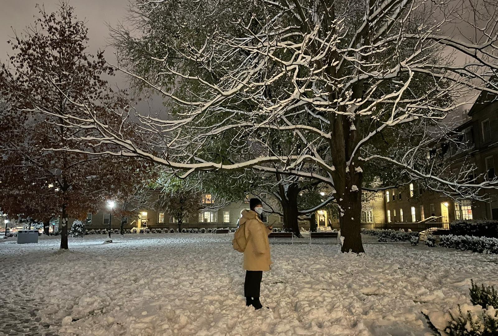 A student standing at an area filled with snow