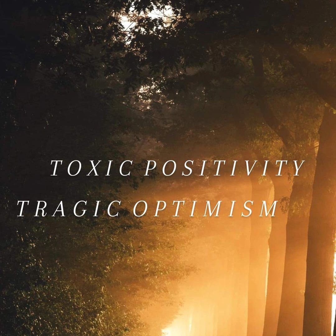 A ray of sunlight in the woods with the words "toxic positivity" and "tragic optimism"