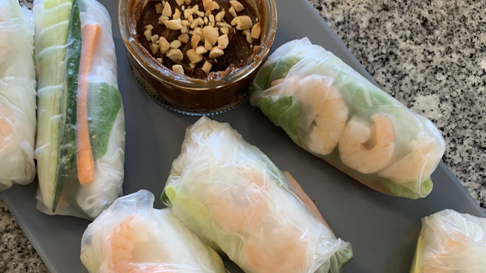 Vietnamese spring rolls with a side of peanut sauce